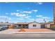 Charming single-story home with xeriscaped front yard and modern wooden address block on a sunny day at 1808 E Saint Louis Ave, Las Vegas, NV 89104