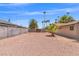 Spacious backyard with gravel landscaping and mature palm trees at 1911 Valley Dr, Las Vegas, NV 89108