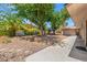 Secluded backyard oasis with mature trees, fire pit, and a charming gazebo at 1911 Valley Dr, Las Vegas, NV 89108