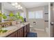 Bathroom featuring double vanity sinks, granite counters, and modern fixtures at 1911 Valley Dr, Las Vegas, NV 89108