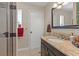 Bathroom featuring a granite-topped vanity, framed mirror, and a step-in shower at 1911 Valley Dr, Las Vegas, NV 89108