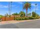Residential property with a secure wooden fence and lush landscaping, offering privacy and curb appeal at 1911 Valley Dr, Las Vegas, NV 89108