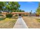 Charming single-story home with a well-maintained lawn and mature trees in a desirable neighborhood at 1911 Valley Dr, Las Vegas, NV 89108