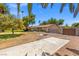 Spacious property featuring mature landscaping, including tall palm trees and large driveway at 1911 Valley Dr, Las Vegas, NV 89108