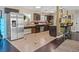 Well-equipped kitchen featuring stainless steel appliances, breakfast bar, and tiled floors at 1911 Valley Dr, Las Vegas, NV 89108