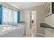 Functional laundry room with granite counters, storage, and access to the bathroom at 1911 Valley Dr, Las Vegas, NV 89108