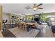 Spacious living room showcasing dining area, ceiling fans, hardwood floors, and plenty of natural light at 1911 Valley Dr, Las Vegas, NV 89108