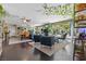 Open concept living room featuring hardwood floors, modern furniture, and beautiful natural light at 1911 Valley Dr, Las Vegas, NV 89108