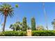 A property entrance framed by mature trees and lush greenery creates a private and inviting atmosphere at 1911 Valley Dr, Las Vegas, NV 89108