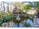 Water feature nestled among lush greenery creates a tranquil and inviting outdoor space at 1911 Valley Dr, Las Vegas, NV 89108