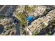 Aerial view of apartment complex showing community pool, landscaping, and parking spots at 2016 Mesquite Ln # 104, Laughlin, NV 89029