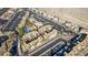 Drone shot of a condo community with mature palm trees surrounding a pool and lots of covered parking at 2016 Mesquite Ln # 104, Laughlin, NV 89029