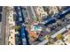 Drone shot of a community pool, desert landscaping, built in tables, covered parking, and mature palm trees at 2016 Mesquite Ln # 104, Laughlin, NV 89029