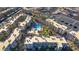 Overhead view of a well-kept apartment complex with a sparkling community pool and manicured landscaping at 2016 Mesquite Ln # 104, Laughlin, NV 89029