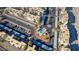 High angle of a neighborhood pool with mature palm trees and built in grilling area and parking at 2016 Mesquite Ln # 104, Laughlin, NV 89029