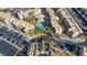 Drone shot of condos with palm trees surrounding a pool, lots of parking, and well maintained streets at 2016 Mesquite Ln # 104, Laughlin, NV 89029