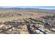 Expansive aerial view of a condo community nestled amongst desert landscaping with a backdrop of scenic mountains at 2016 Mesquite Ln # 104, Laughlin, NV 89029