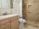 Accessible bathroom featuring a tiled shower with grab bars and modern vanity at 2016 Mesquite Ln # 104, Laughlin, NV 89029