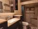 Well-lit bathroom with a vanity sink and tiled walk-in shower at 2016 Mesquite Ln # 104, Laughlin, NV 89029