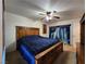 Comfortable bedroom with a wooden bed frame and decorative waterfall curtain at 2016 Mesquite Ln # 104, Laughlin, NV 89029