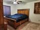 Cozy bedroom featuring a wooden bed frame and matching furniture at 2016 Mesquite Ln # 104, Laughlin, NV 89029