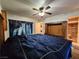 Comfortable bedroom with a wooden bed frame, ensuite, and a stackable washer and dryer at 2016 Mesquite Ln # 104, Laughlin, NV 89029