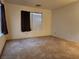 Spacious bedroom with neutral walls, plush carpeting, and ample natural light at 2016 Mesquite Ln # 104, Laughlin, NV 89029