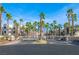 Gated community entrance with beautiful mature palm trees at 2016 Mesquite Ln # 104, Laughlin, NV 89029