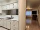Bright kitchen with white cabinets flows into living room with fireplace at 2016 Mesquite Ln # 104, Laughlin, NV 89029
