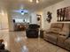 Open living area featuring neutral tones, tile flooring, and a view into the kitchen at 2016 Mesquite Ln # 104, Laughlin, NV 89029