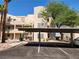 Condo building exterior showcasing covered parking with clearly marked spaces at 2016 Mesquite Ln # 104, Laughlin, NV 89029