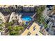 Overhead view of the community pool and spa with surrounding green landscaping and residential buildings at 2016 Mesquite Ln # 104, Laughlin, NV 89029