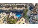 Aerial view of the community pool area showcasing the pool, spa, lounging area, and surrounding landscaping at 2016 Mesquite Ln # 104, Laughlin, NV 89029