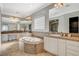 A luxurious bathroom features a large soaking tub, double vanity, and tiled floor at 2172 De Rouge Ave, Henderson, NV 89044