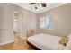 Bedroom features hardwood floors, neutral paint, and bright shutters at 2172 De Rouge Ave, Henderson, NV 89044