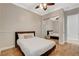 Bedroom with mirrored closet doors, light walls, and hardwood flooring at 2172 De Rouge Ave, Henderson, NV 89044