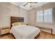 Cozy bedroom with natural light, light-colored walls, and elegant hardwood floors at 2172 De Rouge Ave, Henderson, NV 89044