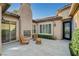 Outdoor patio with fireplace and seating, a perfect place to sit and relax at 2172 De Rouge Ave, Henderson, NV 89044