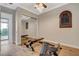 Bright exercise room features hardwood floors, mirrored wall and an exercise machine at 2172 De Rouge Ave, Henderson, NV 89044