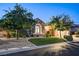Beautiful home with manicured lawn, stone accents, and mature trees in a desirable neighborhood at 2172 De Rouge Ave, Henderson, NV 89044