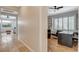Hallway showcasing wood floors, an open floorplan, and an office with built-in shelving at 2172 De Rouge Ave, Henderson, NV 89044
