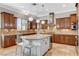 Stylish kitchen featuring granite countertops, stainless steel appliances, and an island with pendant lighting at 2172 De Rouge Ave, Henderson, NV 89044