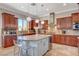 Elegant kitchen featuring custom wood cabinetry, granite countertops, and stainless steel appliances at 2172 De Rouge Ave, Henderson, NV 89044