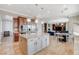 Spacious kitchen with island, stainless appliances, and breakfast nook overlooking the living area at 2172 De Rouge Ave, Henderson, NV 89044