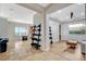 Open-concept living room with tile floors, coffered ceilings, and large windows for ample natural light at 2172 De Rouge Ave, Henderson, NV 89044