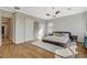 Main bedroom boasts hardwood flooring, sliding door access, and custom bedside tables at 2172 De Rouge Ave, Henderson, NV 89044