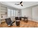 Well-lit office with hardwood floors, built in shelving and plenty of natural light at 2172 De Rouge Ave, Henderson, NV 89044