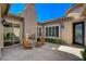 Inviting outdoor patio with a fireplace, sliding glass doors, and comfortable seating area at 2172 De Rouge Ave, Henderson, NV 89044