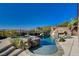 Luxury pool area with rock features, slide, and spa for outdoor relaxation at 2172 De Rouge Ave, Henderson, NV 89044