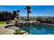 Backyard pool and spa surrounded by lush landscaping with mountain views at 2172 De Rouge Ave, Henderson, NV 89044